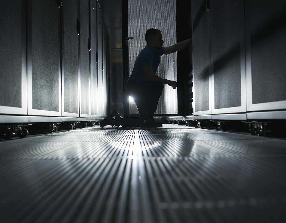 image of technician servicing servers
