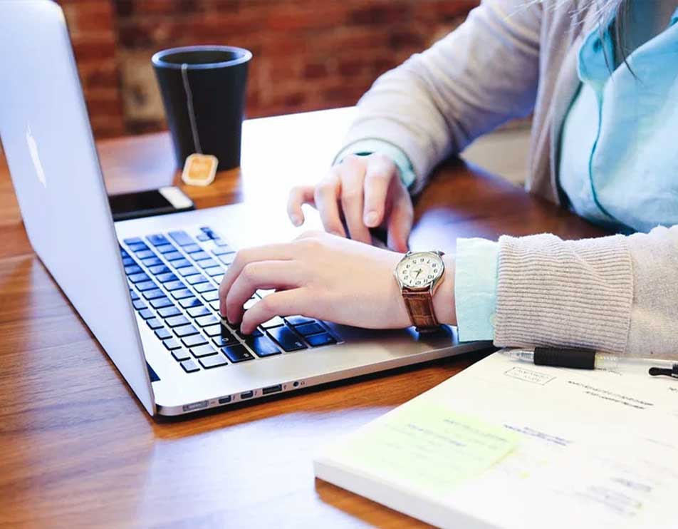image of a business person using laptop