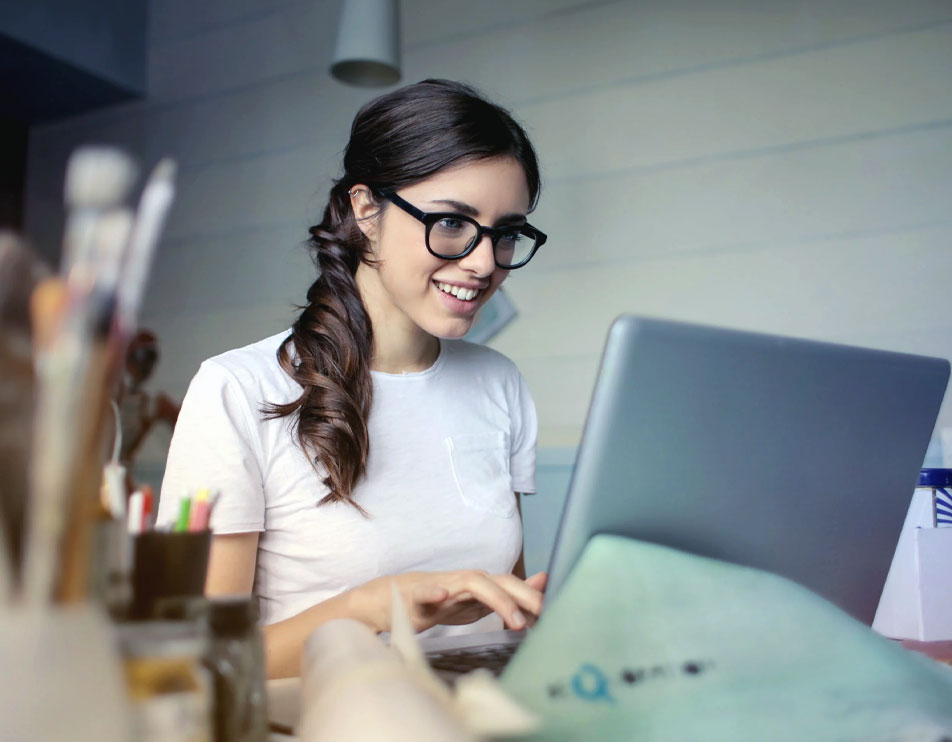 photo of a self employed woman using a laptop